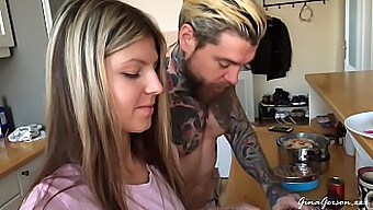 A Young Couple Prepares A Meal Together At Home